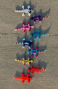 an aerial view of colorful kites flying in the sky