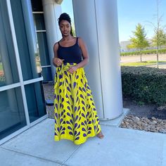 African Ankara Print Long Skirt Elastic Waist A Line Skirt With Elastic Made With Poly Cotton Fabric Yellow, Purple With Black Model Wears Size 12 Yellow Summer Maxi Skirt With Elastic Waistband, Yellow Maxi Skirt For Day Out, Fitted Flared Yellow Maxi Skirt, Yellow Wide Leg Maxi Skirt For Spring, Yellow Flowy Maxi Skirt For Day Out, Yellow Wide Leg Maxi Skirt With Lining, Yellow Flowy Maxi Skirt For Summer, Fitted Yellow Maxi Skirt, Summer Yellow Flowy Maxi Skirt