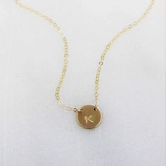 "This stunning petite initial necklace can be customized with a special initial of your choice. Choose from sterling silver, 14kt gold filled or rose gold filled. Classic and timeless, perfect for everyday wear. D E T A I L S -Petite disc measures 10mm - Choose from sterling silver, 14kt gold filled or rose gold filled. -A high quality delicate chain with a spring clasp. -Polished to a light satin finish. CUSTOM HAND STAMPING -Each disc is hand stamped with your initial -Choose your font in phot Minimalist 14k Gold Hand Stamped Charm Necklace, Dainty Hypoallergenic Initial Pendant Necklace, Dainty Hand Stamped 14k Gold Necklace, Rose Gold Initial Pendant Charm Necklace For Her, Minimalist 14k Gold Filled Charm Necklace With Initial Pendant, Rose Gold Initial Pendant Necklace As Gift For Her, Rose Gold Initial Necklace Pendant As Gift For Her, Dainty 14k Gold Filled Hand Stamped Necklace, Minimalist Rose Gold Hand Stamped Charm Necklaces