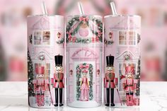 the nutcrackers are dressed in pink for christmas