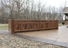 a large wooden cabinet sitting on top of a driveway