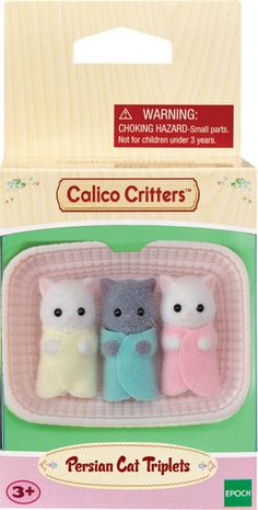 three small stuffed animals in a pink box