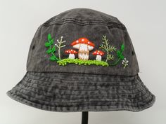 This hand embroidered cotton bucket hat is a stylish accessory that combines function with unique, handmade design. Made from high-quality cotton, it provides comfort and protection from the sun, making it perfect for outdoor activities. The intricate floral embroidery is meticulously crafted by hand, giving each hat a one-of-a-kind touch. Whether you're at the beach, camping, or just running errands, this cotton hat is both practical and fashionable. Item: mushroom embroidered bucket hat Materi Bucket Hat Embroidery Ideas, Bucket Hat Design Ideas, Embroidery Hat, Bucket Hat Embroidery, Bucket Hat Ideas, Yellow Bucket Hat, Cute Bucket Hats, Bucket Hat Outfit, Embroidered Bucket Hat