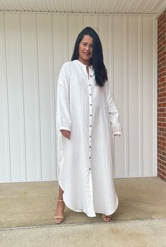 Relax in style with the white Aura shirtdress, a unique take on traditional loungewear. Made from breathable double gauze cotton, it's perfect for casual wear out, at home, or even as a beach coverup. The button-down design adds a touch of style and versatility to your wardrobe, ensuring comfort and convenience as you go about your day. White Long Shirt Dress For Summer, White Summer Shirt Dress With Buttons, White Long Shirt Dress For Beach, White Linen Button Dress For The Beach, Vacation Cotton Tunic Shirt Dress, White Linen Dress With Buttons For The Beach, Cotton Tunic Shirt Dress For Vacation, White Bohemian Shirt Dress For Summer, White Buttoned Shirt Dress For Beach