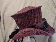 a crocheted hat on top of a coffee cup