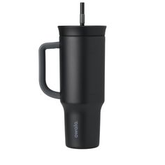 the black travel mug has a handle and is holding a straw in it's mouth