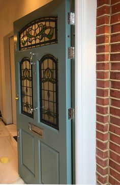 a blue door with stained glass on it