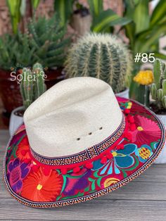 This beautiful Mexican Fedora is made out of Palm and has beautiful embroidered flowers. It is perfect to add that special touch to any outfit. The hat itself is made out of Palm and is very light and breathable. Find more colors here: https://www.etsy.com/es/listing/1004902053/sombrero-mexicano-de-palma-sombrero?ref=listing_published_alert Multicolor Panama Hat For Spring Festival, Traditional Hat For Beach And Cinco De Mayo, Bohemian Wide Brim Hat For Cinco De Mayo, Multicolor Hats For Vacation And Cinco De Mayo, Multicolor Bohemian Panama Hat With Curved Brim, Multicolor Flat Brim Panama Hat For Festival, Bohemian Multicolor Panama Hat With Curved Brim, Multicolor Wide Brim Panama Hat For Festivals, Traditional Multicolor Wide Brim Sun Hat