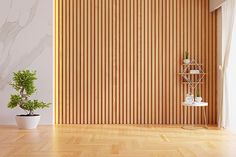 an empty room with wood paneling and a potted plant on the floor in front of it