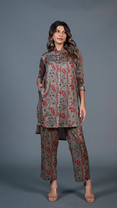 Versatile and stylish, this contemporary shirt pant set, will occupy a distinct spot in your wardrobe. Being in vogue does not mean you have to compromise on comfort. It is made with superior quality chanderi silk.The Hi-low style shirt adds a touch of class to this set. This set can be easily styled for a formal or ca Silk Co Ord Set, Shirt Pant, Dress Idea, Dusty Green, Shirt Pant Set, Saree Dress, Co Ord Set, Style Shirt, Pant Set