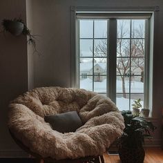 a living room filled with furniture and a large window covered in frosty glass doors