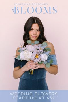 a woman holding flowers in her hands with the words bloom's written on it