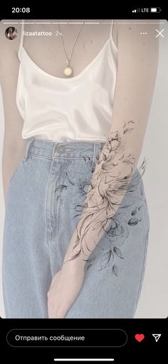 a woman's arm with flowers tattooed on it