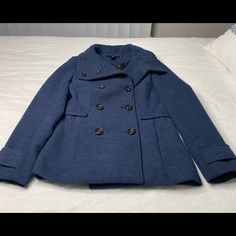 Like Brand New Blue Double-breasted Peacoat For Winter, Blue Casual Long Sleeve Pea Coat, Casual Blue Pea Coat, Blue Outerwear For Cold Weather With Button Closure, Blue Outerwear With Button Closure For Cold Weather, Blue Winter Peacoat, Casual Blue Double-breasted Outerwear, H&m Double-breasted Workwear Outerwear, Blue Long Sleeve Pea Coat For Fall