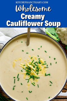 a bowl filled with creamy cauliflower soup on top of a wooden table