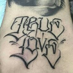 a man's foot with the words truly love written in black ink on it