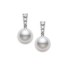 As part of the Morning Dew collection by Mikimoto, these earrings have a brilliant shimmer. Graduated blue sapphires set in 18kt white gold dangle a gorgeous South Sea pearl beautifully. With a colorful twist to a time-honored classic, this set of Mikimoto earrings will elevate you look with a touch of modern class. Diamond White Pearl Drop Jewelry For Formal Occasions, Pearl White Jewelry With Diamond Accents For Formal Occasions, Formal Pearl White Jewelry With Diamond Accents, Formal Diamond White Jewelry With Pearl Drop, Formal Diamond White Pearl Drop Jewelry, Elegant Pendant Earrings In Diamond White, Elegant White Jewelry With Pearl Charm, Elegant Diamond White Pendant Earrings, Luxury White Pearl Chain Earrings