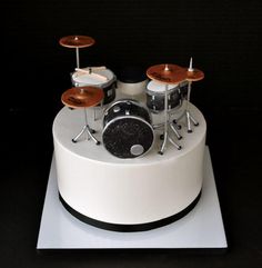 a birthday cake with a drum set on top