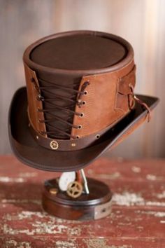 Steampunk Victorian Vested Leather Hat By Overland Sheepskin Co, http://www.overland.com/Products/NewNotable-590/MadeintheUSACanada-697/MadeintheUSAMensAccessories-640/SteampunkVictorianVestedLeatherHat/PID-70617.aspx Victorian Vest, Brown Leather Hat, Moda Steampunk, Corset Steampunk, Leather Top Hat, Steampunk Top, Brown Leather Top, Steampunk Top Hat, Steampunk Hat