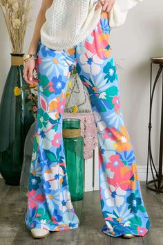 This Item is Final Sale Unleash your wild side with our Everlane Multi Print Flare Pants! These bell bottom pants are not your average pair, with a mix of floral prints that are sure to turn heads. The elastic waist ensures a comfortable fit while the flare design adds a touch of retro style. 95% Polyester & 5% Spandex Trendy Blue Summer Flares, Blue Stretch Flares For Spring, Spring Stretch Blue Flares, Spring Hippie Wide Leg Flares, Hippie Wide Leg Spring Flares, Hippie Wide Leg Flares For Spring, Hippie Wide Leg Floral Print Bottoms, Hippie Wide Leg Bottoms With Floral Print, Hippie Wide-leg Bottoms With Floral Print