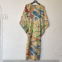 "This Beautiful Indian Cotton Caftan or can be called as Tunic is made with super fine quality cotton and designs have been crafted by Hand Prints. Measurements :- Size - Free Size Length -130 Cm /52\" Inches Bust/chest size - 120 CM/ 48\" Inches Fabric - 100% Cotton Pattern - Floral Kaftan has Adjustable Drawstring Waist to loose or tight , Kaftan has V Shape Neck Which is 8\" Inches Deep. Kaftan Is Multi-purposeand can be worn as a cover up at the Beach ,Loumge wear ,sleepwear ,Pregnant Women Beige Floral Print Beach Kimono, Beige Spring Kaftan For Beachwear, Spring Beachwear Beige Kaftan, Fitted Beige Bohemian Cover-up, Beige Spring Beachwear Kaftan, Traditional Beige Kimono For Vacation, Beige Long Kaftan For Vacation, Traditional Beige Kimono For Beach, Beige Kaftan For Festival Beachwear