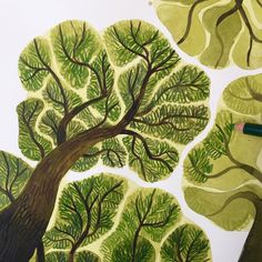 a drawing of a tree with green leaves on it and a pencil in the foreground