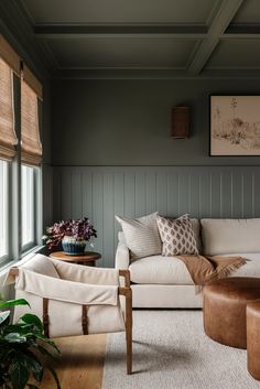 a living room filled with furniture and lots of pillows on top of it's couches