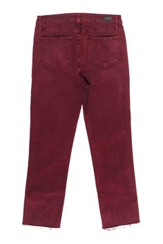 Go daring in denim with these Paige jeans! Created in a trendy straight leg silhouette with a rich maroon hue and edgy raw hem, these bold beauties are sure to make a statement this fall! All eyes will be on you at the pumpkin patch, apple orchard and beyond when your pair these with a chunky turtleneck and your best booties. Missing size tag, measures 30 98% Cotton, 2% Spandex Made in USA Concealed front zipper w/ button at waist High waisted, straight leg silhouette Open pockets on front and b Trendy Fall Cropped Jeans, Straight Leg Pants With Frayed Hem For Fall, Frayed Hem Pants For Fall Workwear, Fall Cropped Cotton Jeans With Five Pockets, Casual Burgundy Pants For Fall, Casual Burgundy Bottoms For Fall, Trendy Straight Cropped Jeans For Fall, Casual Burgundy Straight Leg Bottoms, Red Relaxed Fit Jeans For Fall