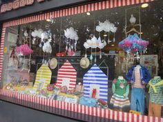 the front window of a store that sells christmas decorations