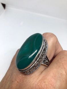 Large green agate Ornate German Silver Vintage ring, does not tarnish Size 9 can be re sized, my jeweler charges a $10 - $15 fee All rings are shipped in a nice gift box. Check out our over a THOUSAND great reviews Engraving is $4 per letter and is not always perfect depending on the piece. It can take a few days if the jeweler is busy. This is payable to Paypal Judithsltd@gmail.com Green Oval Cabochon Ring For Gift, Green Ring With Large Stone, Handmade Green Oval Cabochon Ring, Green Onyx Rings For Gift, Green Agate Oval Rings, Green Oval Agate Rings, Bohemian Green Oval Cabochon Ring, Handmade Green Oval Crystal Ring, Unique Green Nickel-free Rings