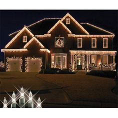 a house covered in christmas lights at night