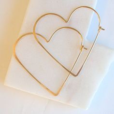 Heart shaped hoops, lightweight and minimalist. Choose from three sizes and from sterling silver, 14k gold fill or rose gold fill. Super lightweight, you won't even know they are there. Small .75" Medium 1.25" Large 1.75”Metal: Choose from sterling silver, 14k gold fill, rose gold fill****Earring Replacements**** If you were to lose an earring, I will be happy to make a matching one for half price and free shipping!All orders come packaged ready for gift giving. In order to keep down on waste, o Minimalist Hoop Earrings With Heart Charm For Anniversary, Minimalist Hoop Earrings With Heart Charm, Nickel-free Minimalist Open Heart Earrings, Minimalist Nickel-free Open Heart Earrings, Minimalist 14k Gold Filled Heart Earrings, Minimalist Everyday Hoop Heart Earrings, Minimalist Heart Pendant Earrings For Everyday, Minimalist Everyday Heart Pendant Earrings, Minimalist Everyday Open Heart Earrings