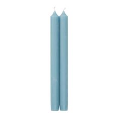 two light blue candles on a white background