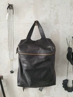 A just-right backpack with a minimalist silhouette, this rich - leather backpack features geometric cut with a deep, lined interior with 2 large departments, a zipper pocket, adjustable strap and a antique gold hardware for an chic updated finishing touch. Features: * 1 Interior large zipped pocket * Outside zipper pocket in the back of the bag * Fully lined with strong Black cotton * 2 departments * Adjustable shoulder strap * zipper closure ◄ DIMENSIONS ► Height: 32 cm/ 12.5'' Width: 33 cm / 1 Backpack Purse Leather, Leather Backpack Women, Small Backpack Purse, Small Leather Backpack, Leather Phone Pouch, Laptop Backpack Women, Small Leather Purse, Mini Backpack Purse, Large Leather Bag