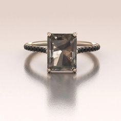 This is our new Smoky Quartz Ring made in 14K Rose Gold. The center stone is about 2.80ct (9x7mm) brown Smoky Quartz (color may vary due to the nature of the stone) set in a four prong solitaire setting. Modern Bride Jewelry, Smoky Quartz Engagement Ring, Black Diamond Engagement Ring Halo, Wedding Rings Emerald Cut, Black Diamond Jewelry, Quartz Engagement Ring, Black Engagement Ring, Smoky Quartz Ring, Quartz Color