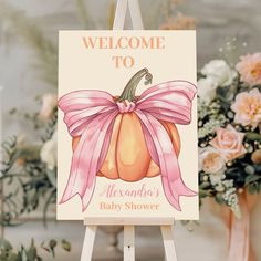 a welcome sign with a pink bow on it