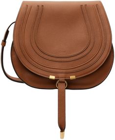 Grained calfskin saddle bag in tan. Burnished edges throughout. · Adjustable pin-buckle shoulder strap · Logo embossed at face · Concealed patch pocket at face · Foldover flap with tab-slot closure · Card slot at interior · Linen twill lining · H10 x W11.5 x D4.5 in Supplier color: Tan Brown Flap Saddle Bag With Gold-tone Hardware, Cognac Saddle Shoulder Bag With Gold-tone Hardware, Brown Saddle Bag With Gold-tone Hardware, Brown Saddle Shoulder Bag With Gold-tone Hardware, Brown Saddle Bag With Detachable Strap, Cognac Saddle Bag With Gold-tone Hardware, Brown Saddle Bag For Office, Cognac Saddle Bag With Leather Lining, Brown Flap Saddle Bag For Work