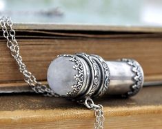 sterling silver container necklace pill box tube locket red | Etsy Antique Silver Necklace For Healing, Antique Sterling Silver Keepsake Jewelry, Spiritual Gemstone Jewelry For Keepsake, Antique Sterling Silver Healing Jewelry, Antique Silver Sterling Silver Keepsake Jewelry, Antique Silver Spiritual Jewelry Gift, Antique Sterling Silver Jewelry For Healing, Antique Silver Spiritual Jewelry As Gift, Silver Locket Necklace For Healing