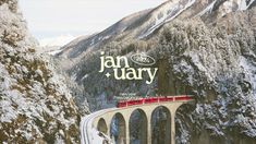 a red train traveling over a snow covered mountain side under a bridge with the words jan ury on it