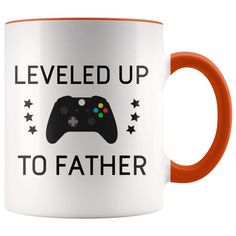 a black and white coffee mug with the words level up to stemom on it