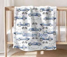 a baby crib with a blue car and stars on it