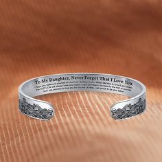 If you're looking for a special and meaningful gift to show your daughter how much she means to you and how proud you are of her accomplishments, this bracelet is a perfect choice. The stunning bracelet design is not only aesthetically pleasing but also a perfect reminder for your daughter that no matter what life throws her way, you'll always have her back. Whether it's her birthday, graduation, or just because, this bracelet is sure to become one of her favorites. Why buy from us?: Crafted In Mother's Day Engraved Stainless Steel Name Bracelet, Engraved Jewelry For Mother's Day And Friendship, Mother's Day Stainless Steel Jewelry With Engraved Text, Meaningful Name Bracelet For Mother's Day Gift, Customizable Inspirational Jewelry For Friendship, Customizable Meaningful Friendship Jewelry, Meaningful Adjustable Jewelry With Engraving Option, Adjustable Meaningful Jewelry With Engraving Option, Mother's Day Gift Stainless Steel Name Bracelet