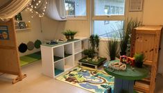 the room is decorated with plants and toys