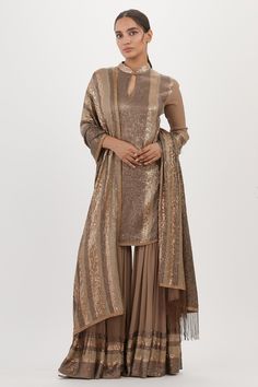 Mouse kurta with sequin embroidery and mandarin neck. Paired with embroidered sharara and embroidered fringe hem dupatta.
Components: 3
Pattern: Embroidered
Type Of Work: Sequin
Neckline: Mandarin
Sleeve Type: Three Quarter
Fabric: Chiffon
Color: Grey
Other Details: 
Sequin work
Embroidered dupatta
Occasion: Sangeet,Reception - Aza Fashions Collar Kurta, Embroidered Sharara, Kurta Sharara Set, Kurta Sharara, Sequin Embroidery, Embroidered Dupatta, Sharara Set, Gold Embroidery, Sequins Embroidery