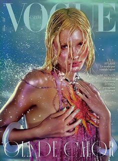 a magazine cover with a woman holding a starfish in her hands and water splashing on her face