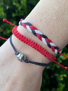 a person wearing two different bracelets on their wrist