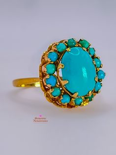 Get ready to fall in love with this exquisite Antique Sleeping Beauty Turquoise Halo 18K Gold Ring! With its captivating design and stunning craftsmanship, this ring is a true gem. Let's delve into the details: Style: Antique Halo flower setting Materials: 18K Gold Ring Size: 6.75 Hallmarks: Unmarked Condition: Good (G) Description: The item exhibits moderate wear but remains in generally good condition. Surface may show visible scratches or wear, though not detracting from the overall appearance. Metals may have a more noticeable patina or signs of gentle aging. Gemstones may have slight abrasions or wear, still retaining their luster.  Specifications: * Primary Stone(s) Type: Turquoise * Primary Stone(s) Shape: Round Cabochon, Oval Cabochon * Primary Stone(s) Dimensions: 2.00 - 9.75 × 7. Victorian Gold Ring, Gold Halo Engagement Ring, Flower Setting, Rose Gold Halo Engagement Ring, Turquoise Gold Ring, Rose Gold Halo, Jewellery Gifts, Victorian Gold, Gold Halo