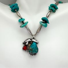 Vintage Southwestern Turquoise Coral Sterling Silver Necklace. Gorgeous Turquoise Coral Sterling Silver Pendant In Traditional Design On Necklace Of Sterling Silver Tube Beads With Turquoise Nuggets. Probably Navajo. Hook And Loop Closure. Necklace Is 18 Inches. Pendant Is 24 X 28 Mm. Turquoise Is 15 X 18 Mm, Coral Is 6 X 7. Largest Nugget Is 10 X 13 Mm. 31.2g Silver Southwestern Multi-stone Turquoise Necklace, Southwestern Silver Turquoise Multi-stone Necklace, Coral Turquoise, Tube Beads, Hook And Loop, Sterling Silver Necklace, Turquoise Jewelry, Sterling Silver Pendant, Traditional Design