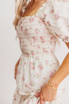 If you're looking ahead to blooming flowers and sunshine, you need this beautiful dress to help herald in springtime! This gem is crafted from a charming, 100% cotton floral print, and features a smocked bodice with sleeves that can be worn on or off the shoulders. It's a must-have for baby showers, gender reveals, or christenings! The Harper is sure to sell out, so don't wait to snag yours! FIT: Runs true to size. The bodice is stretchy and smocked, but the rest of the dress does not have stret Contrasting Stitching, Gender Reveals, Elegant Maxi Dress, Shower Themes, Ditsy Floral Print, Dress Inspo, Pink Floral Dress, Dance Dress, Sell Out