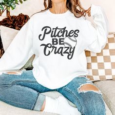 Stay warm and game-day ready with our Pitches Be Crazy sweatshirt. This cozy sweatshirt is perfect for those late night practices and early morning games. Keep yourself comfortable while showing off your love for the game. Unisex fit Stay with your true size for a relaxed fit Size up for a trendy oversized fit Current processing time is 5-10 business days College Sweatshirt With Lettering For Baseball Season, Relaxed Fit Sweater With Letter Print, Team Spirit Sweatshirt For Game Day With Letter Print, Collegiate Style Sweater With Letter Print For Loungewear, Team Spirit Sweatshirt With Ribbed Cuffs For Game Day, Fan Apparel Sweatshirt With Letter Print For Game Day, Fleece Sweatshirt For Sports Fans, Casual Letter Print Sweatshirt For Game Day, Sporty Tops With Letter Print And Cozy Fit